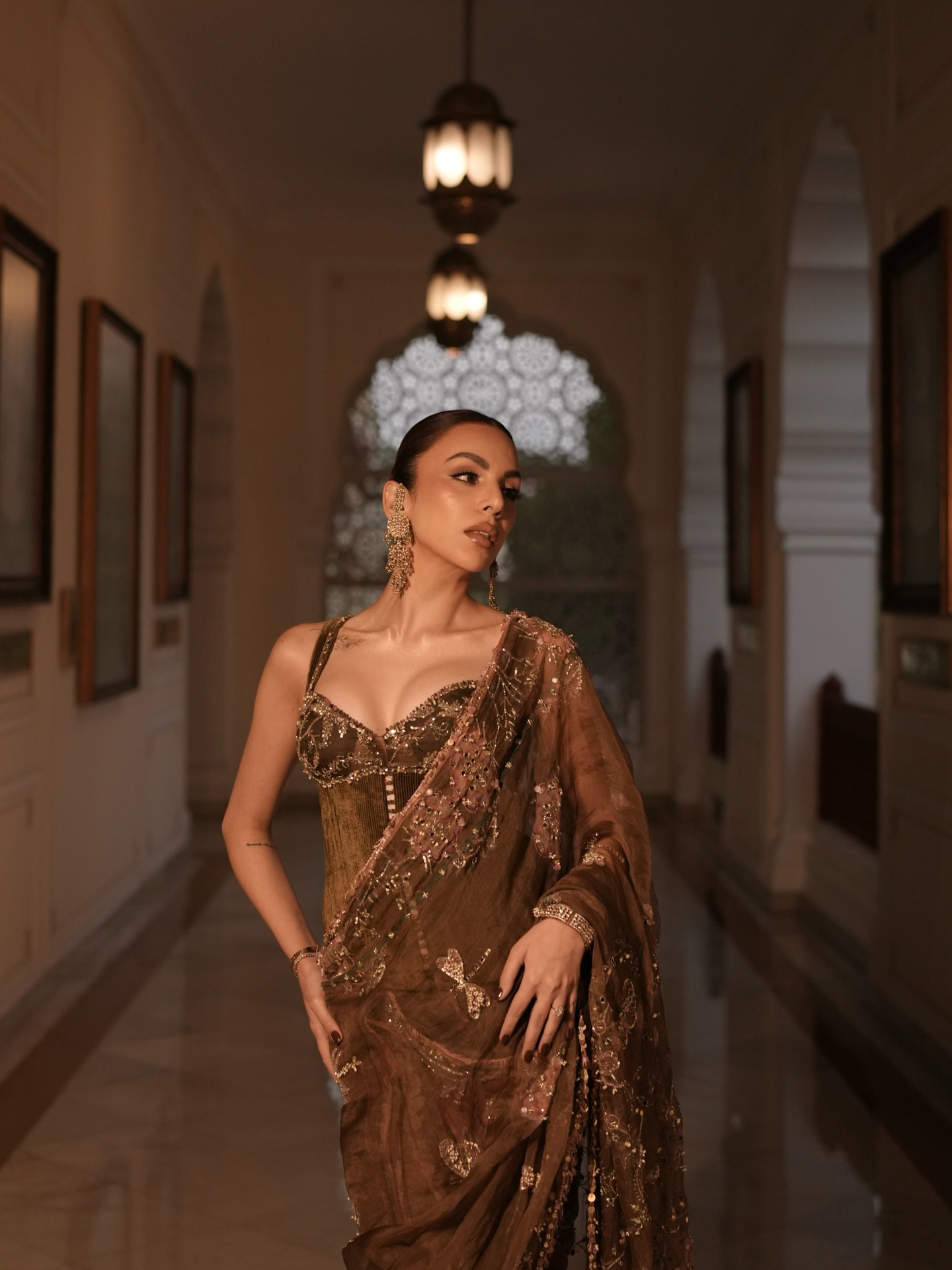 Nitibha Kaul pairs the embellished saree with a structured blouse featuring delicate detailing, creating a silhouette that feels both sophisticated and contemporary.