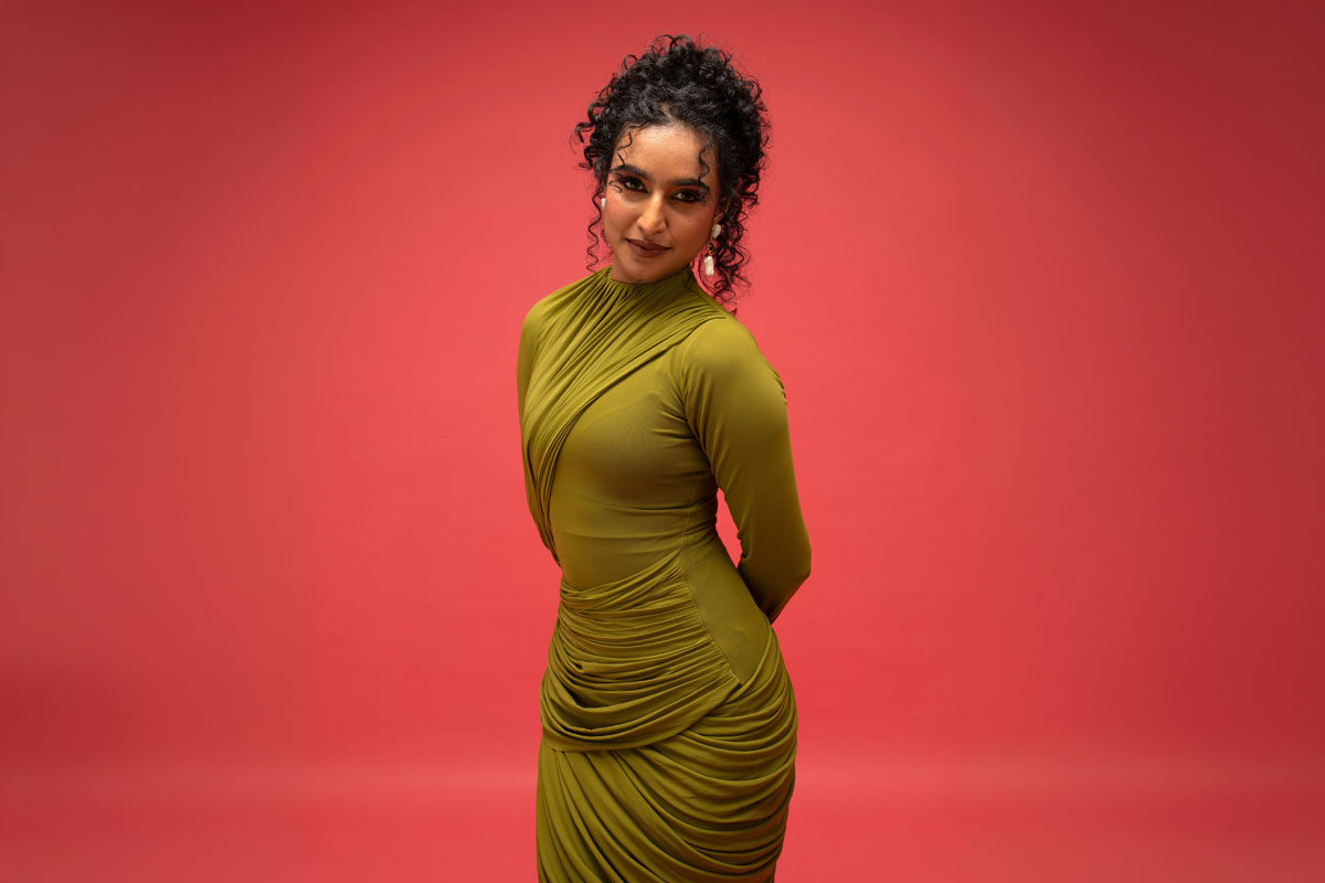 Rida Tharana Keeps It Chic In A Figure-Hugging Olive Green Draped Gown