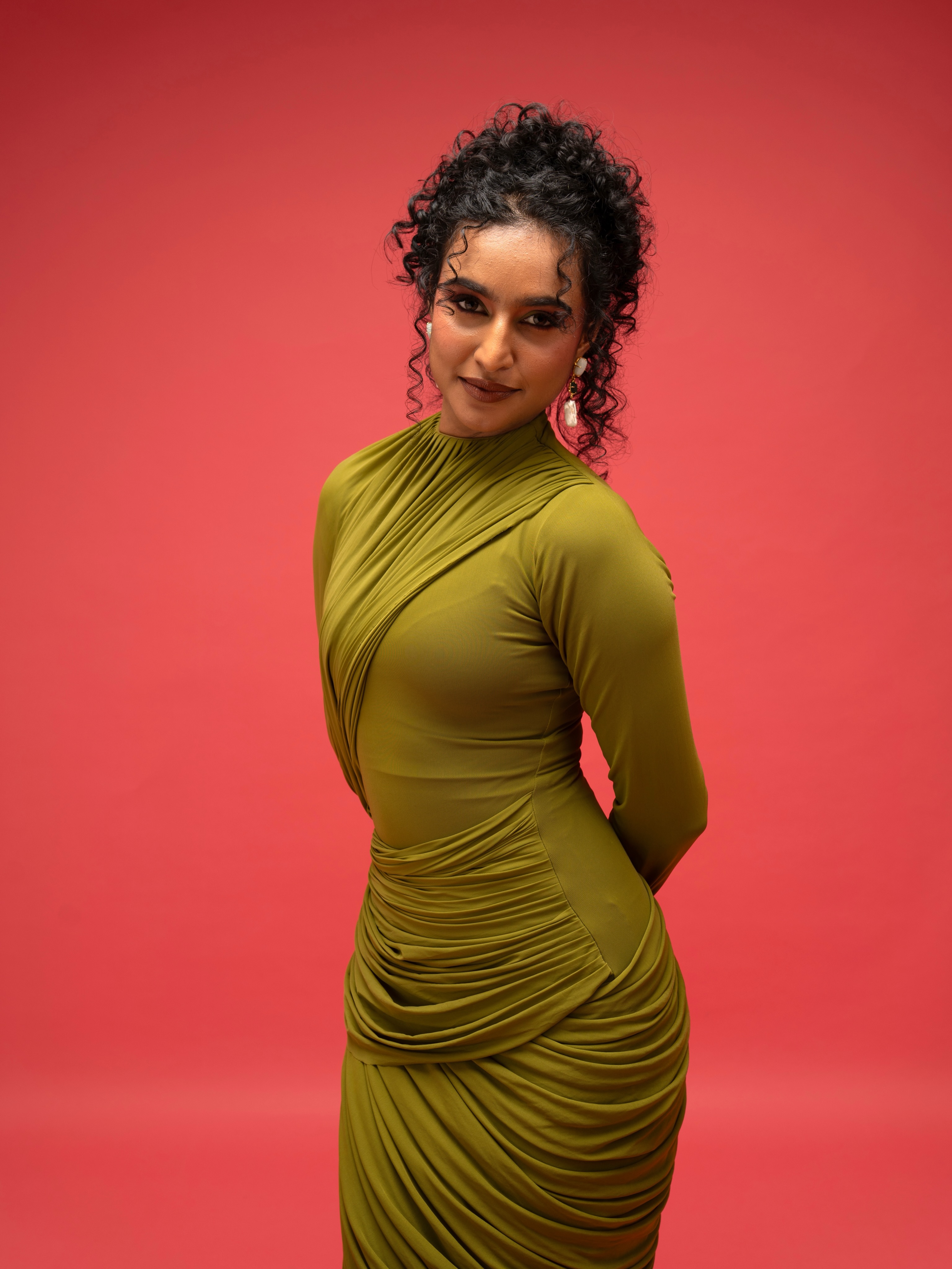 Rida Tharana Keeps It Chic In A Figure-Hugging Olive Green Draped Gown