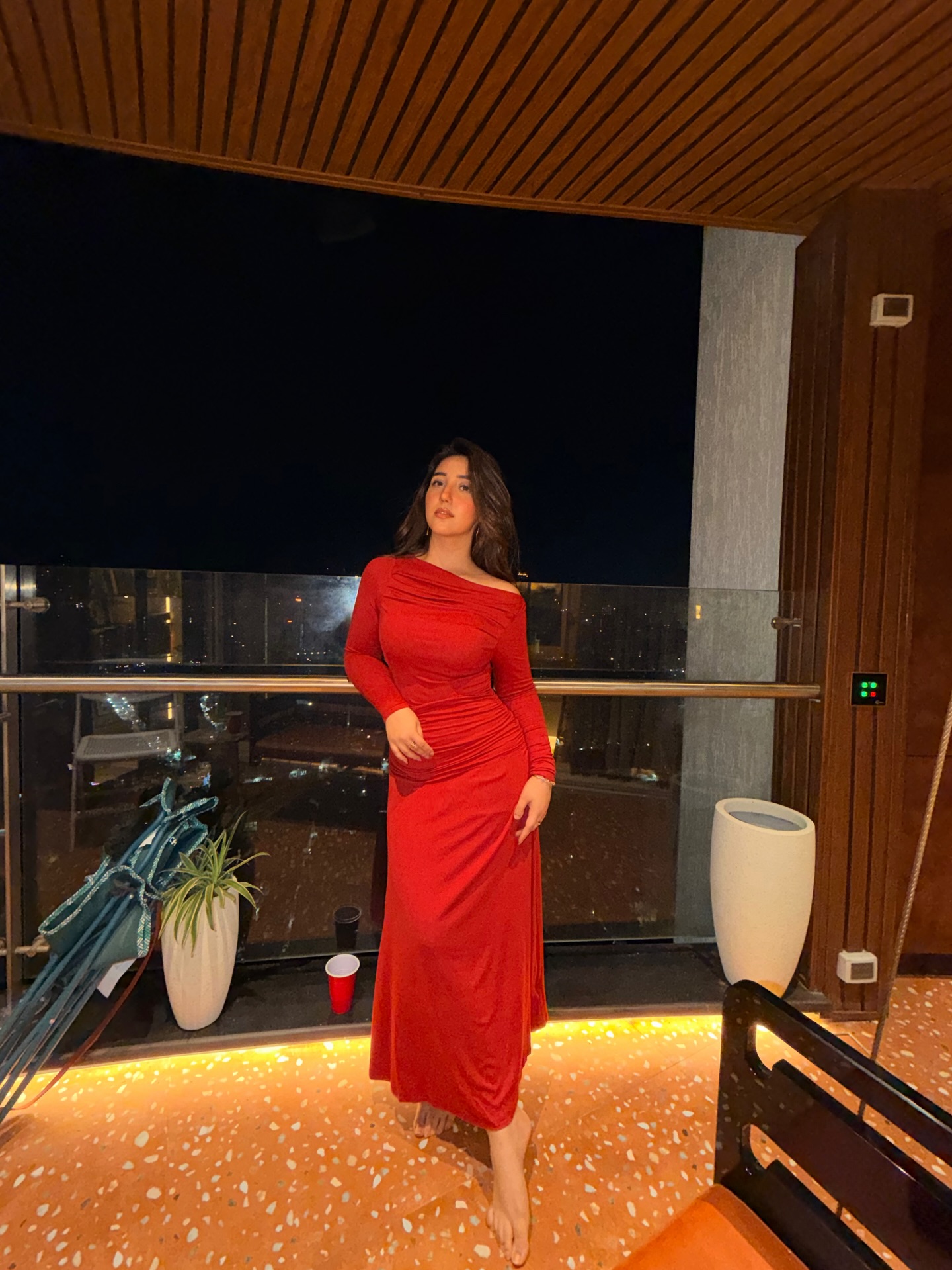 Ashnoor Kaur keeps accessories minimal, letting the bold red outfit stand as the focal point without added noise.