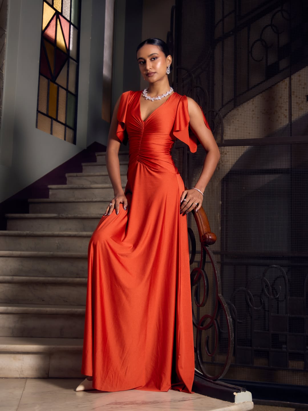 Rida Tharana Brings Coastal Glam Alive in Fiery Orange Dress