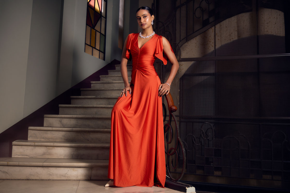 Rida Tharana Brings Coastal Glam Alive in Fiery Orange Dress
