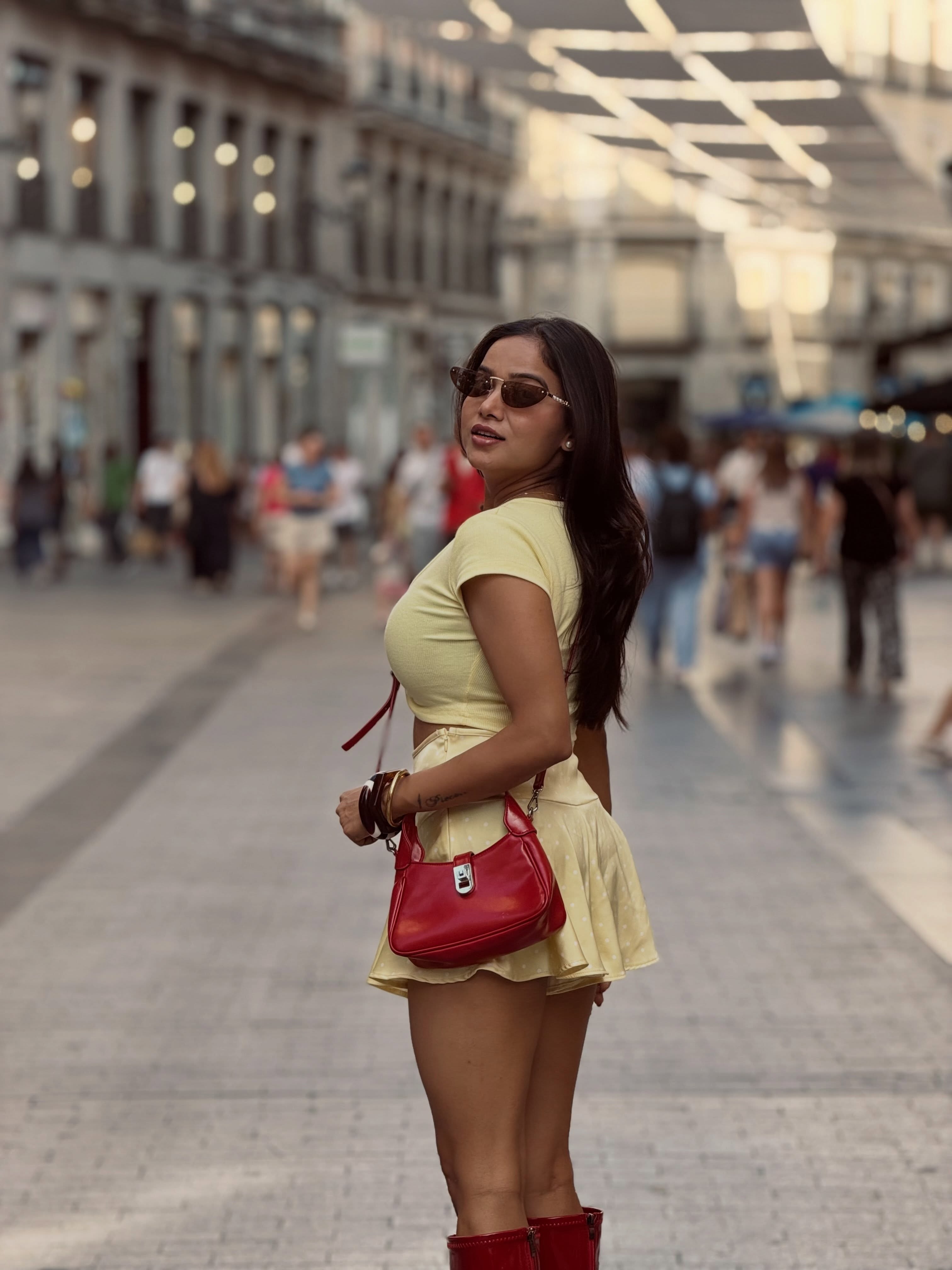 Manisha Rani nails coordinated fashion with a chic cut-out crop top and matching mini skirt that blend comfort with style.