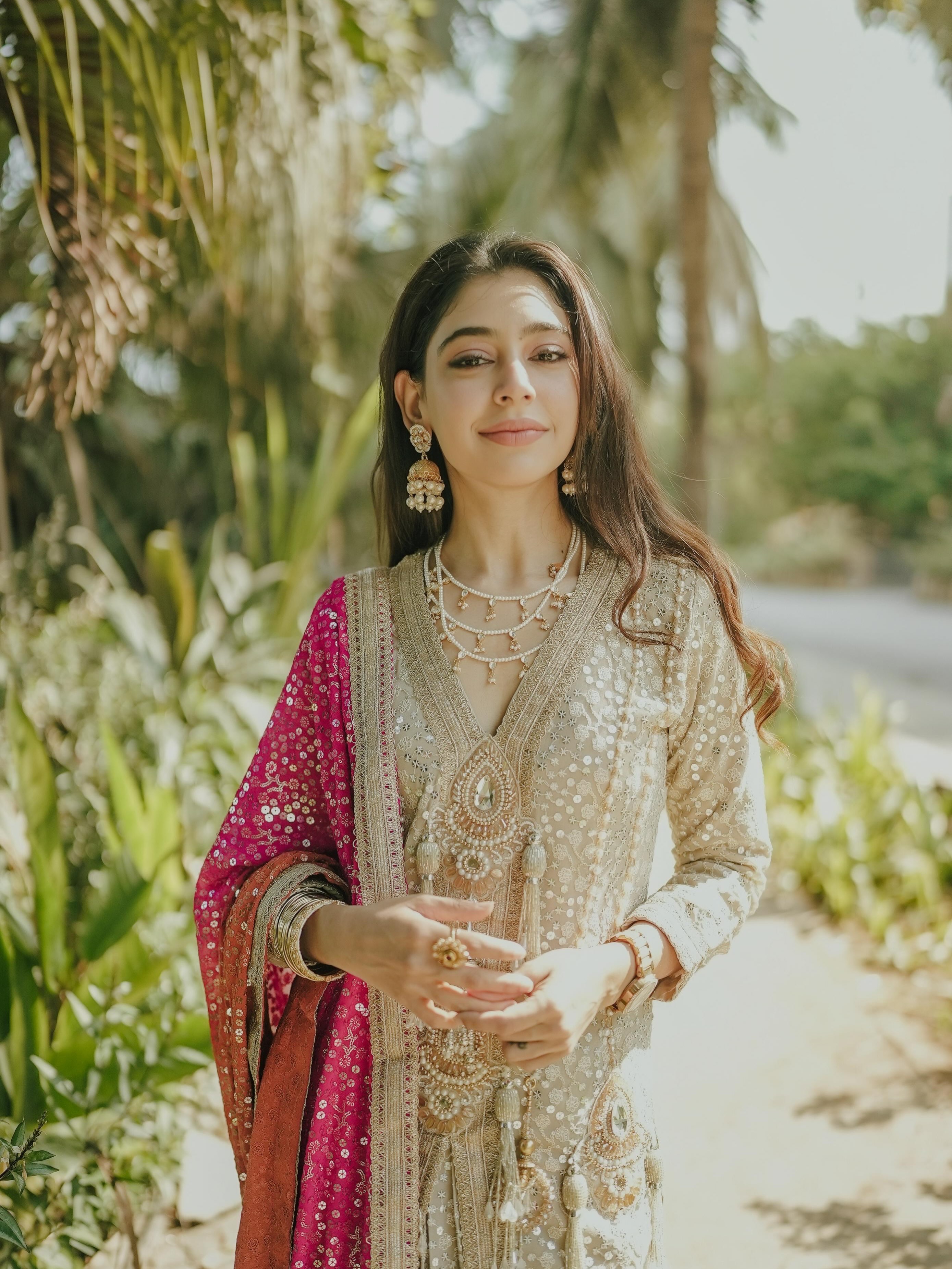 Niti Taylor embraces understated glamour in a delicately embellished ivory ensemble that exudes sophistication.