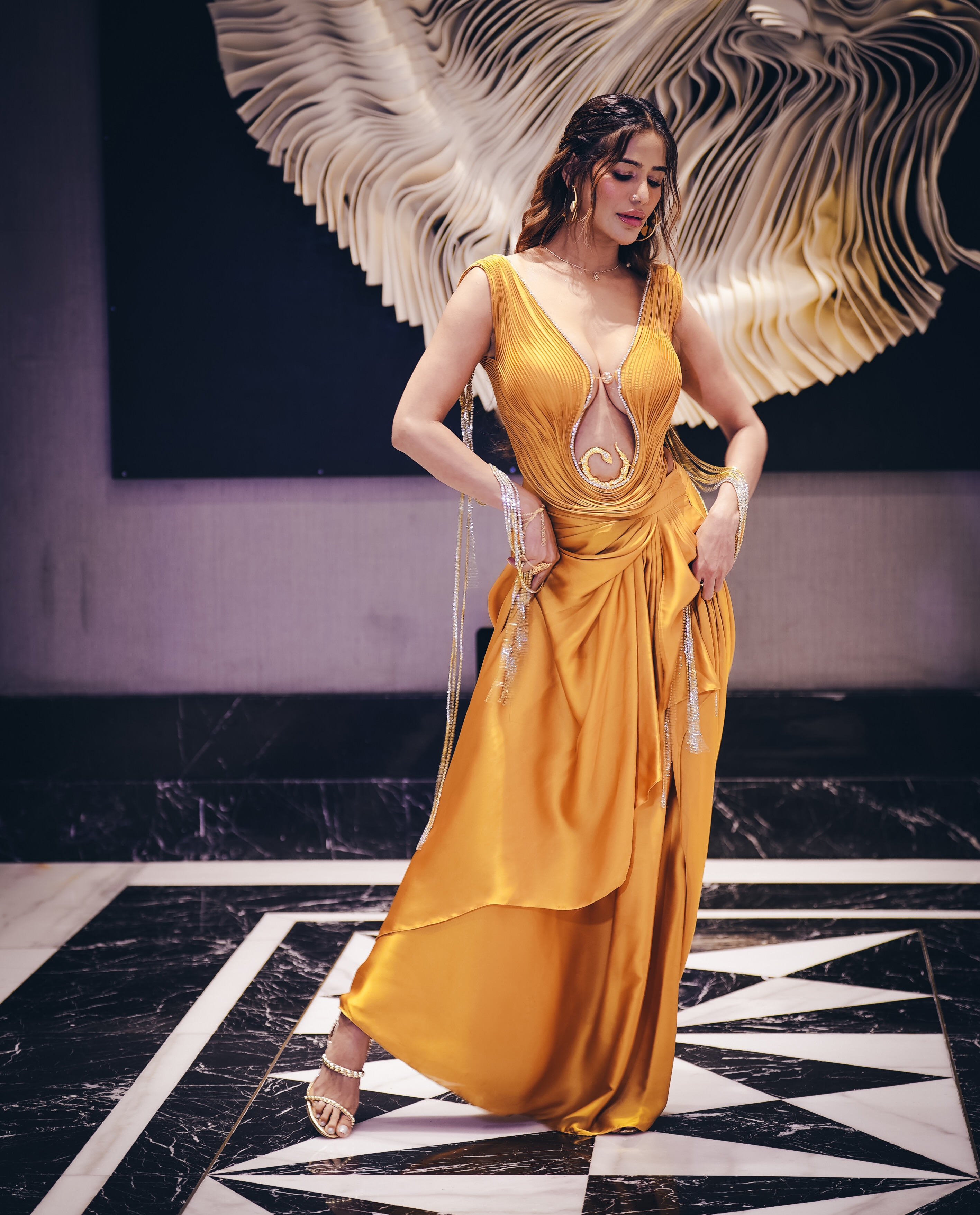 Poonam Pandey shines in radiant gold, turning the spotlight on a richly draped silhouette that exudes luxury and confidence.