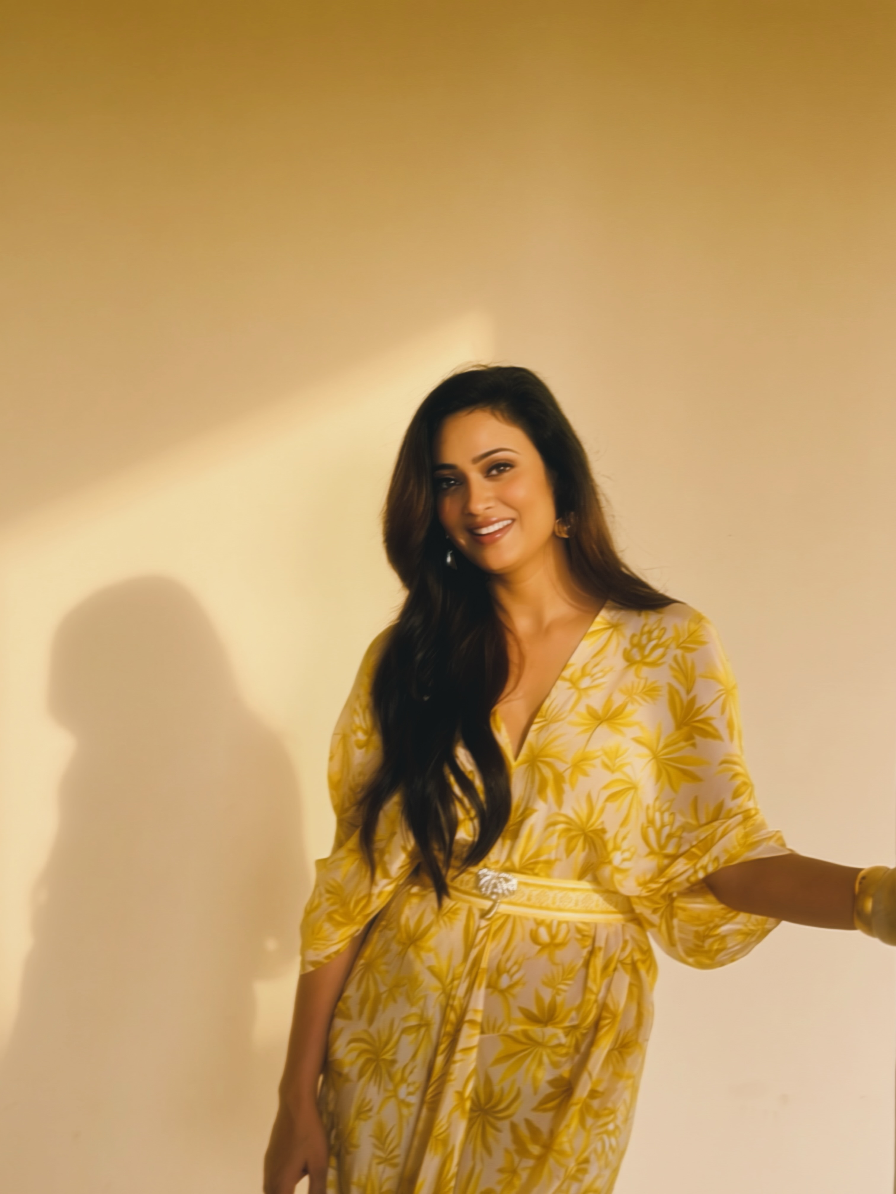 Shweta Tiwari keeps the accessories simple with elegant drop earrings, letting the printed outfit remain the focal point of her effortlessly chic appearance.