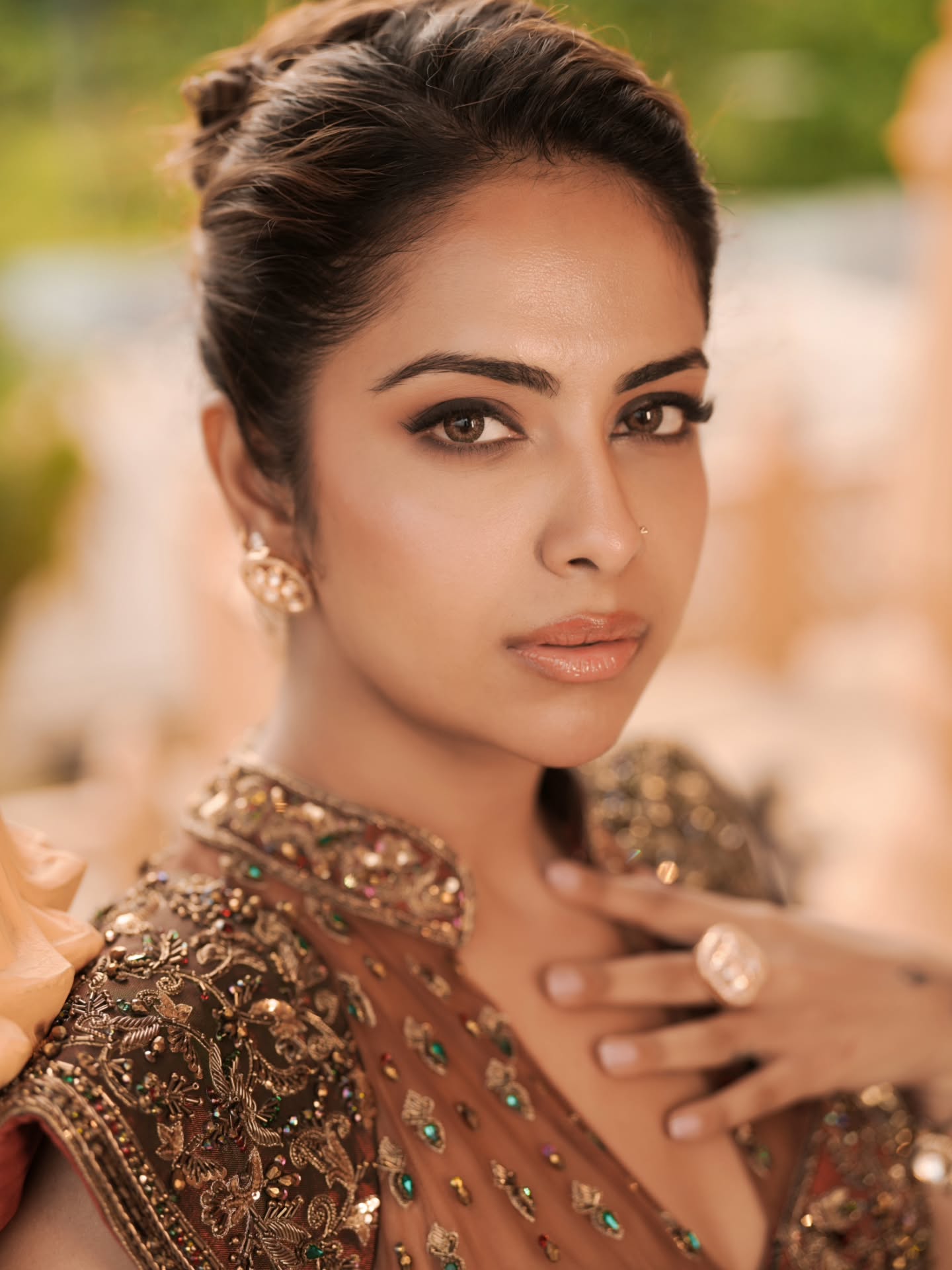 Avika Gor pairs the voluminous skirt with an intricately embroidered blouse featuring structured shoulders and ornate detailing that adds a regal touch.