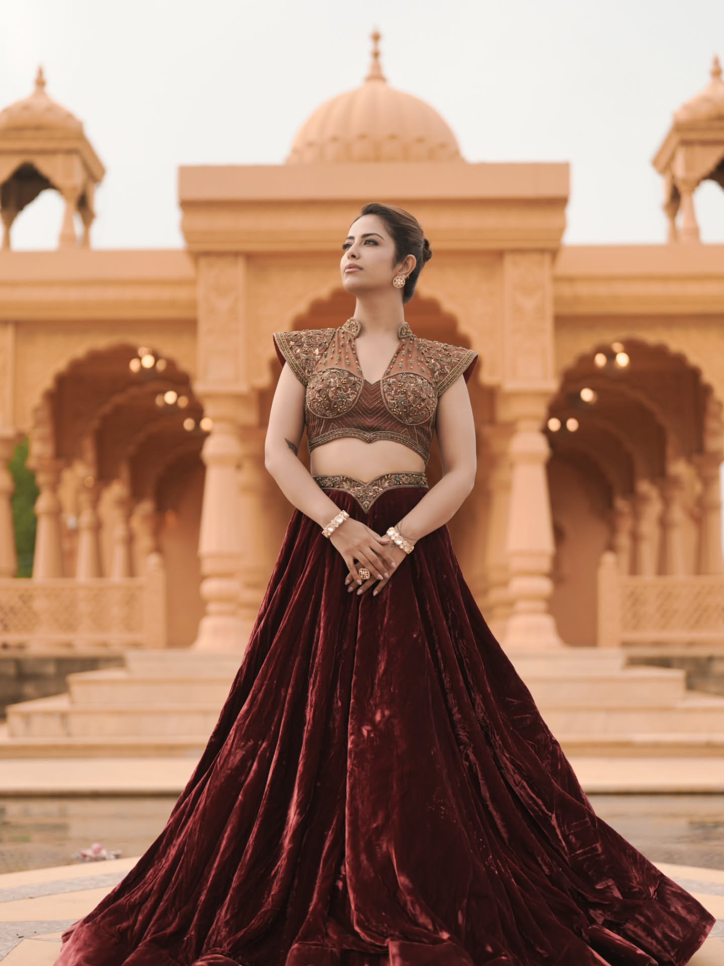 Avika Gor opts for defined eyes, softly sculpted makeup, and a sleek updo that allows the outfit's intricate detailing to remain the focal point.