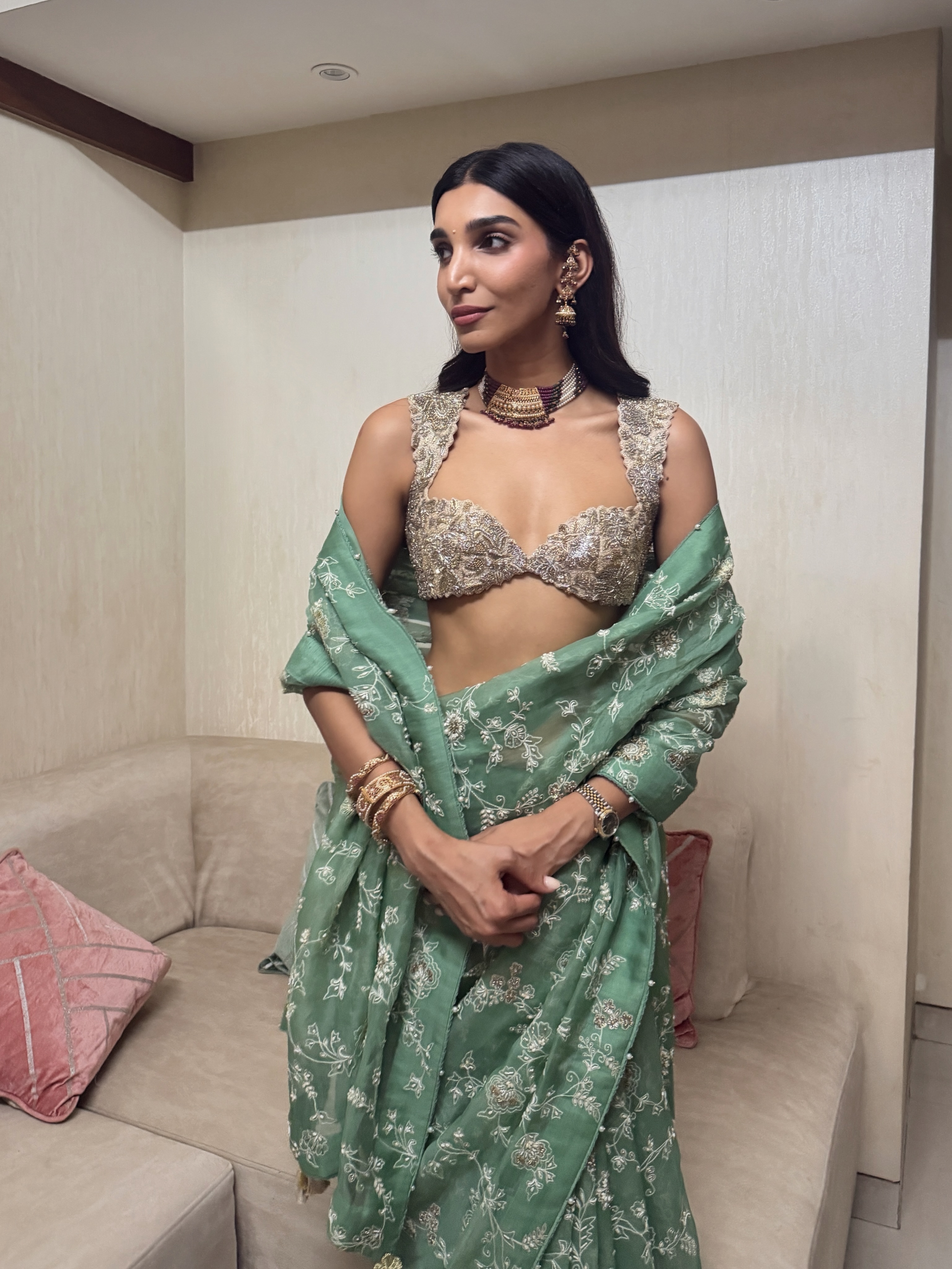 Juhi Godambe opts for radiant makeup, softly defined eyes, and sleek straight hair, allowing the outfit and accessories to remain the focal point.