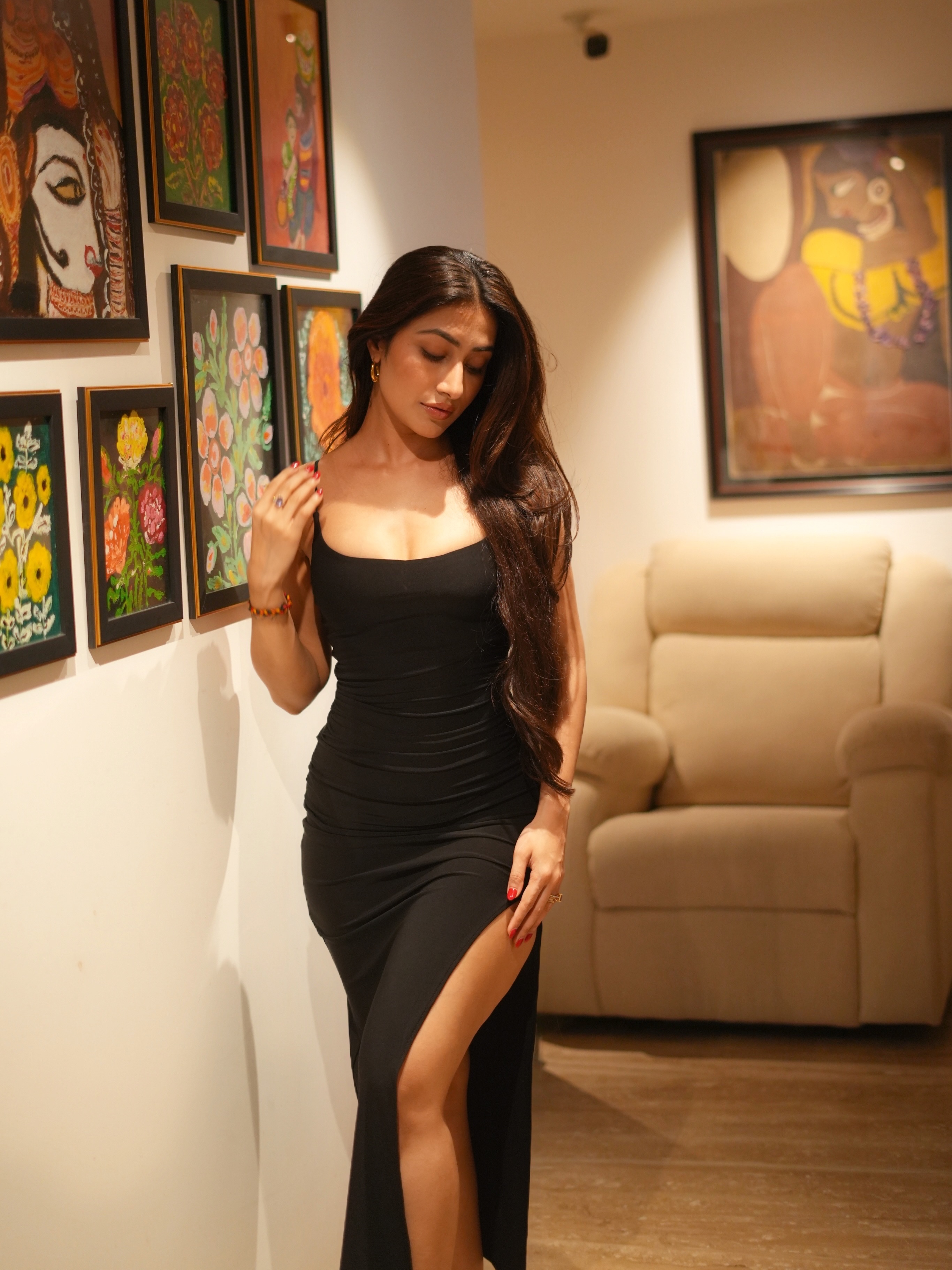 Dhanashree Verma keeps the styling minimal with a delicate bracelet and ring, allowing the statement dress to shine.