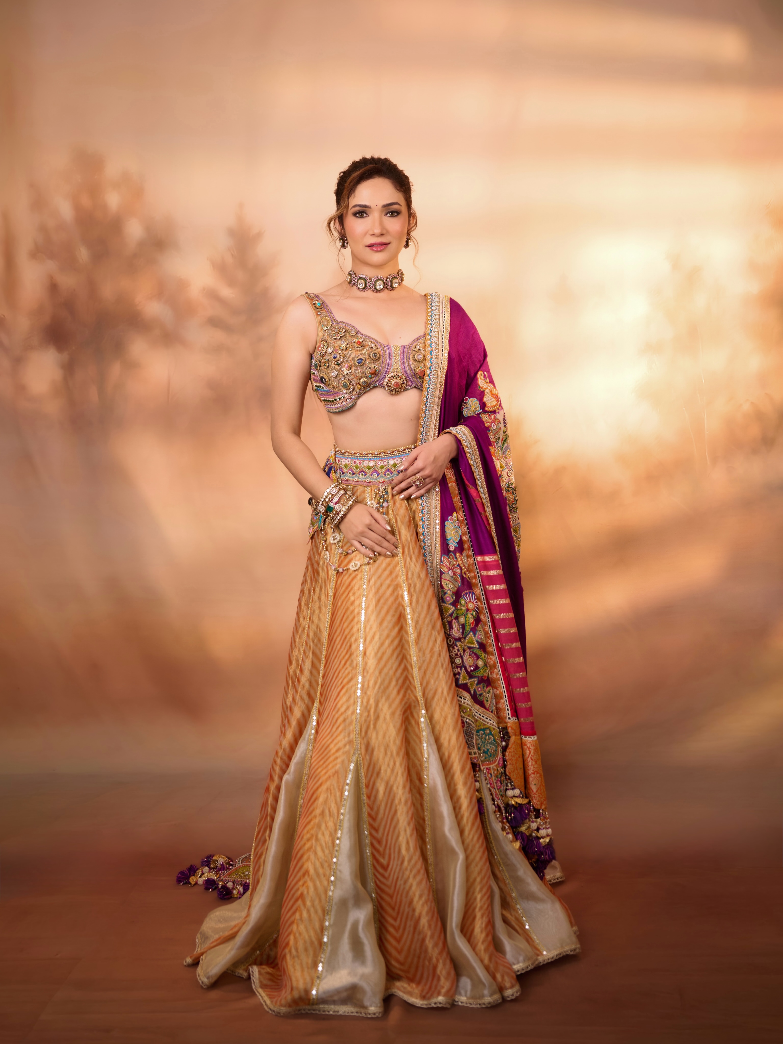 Ridhima Pandit brings embroidery, rich colours, statement jewellery, and metallic accents together for an eye-catching festive look.