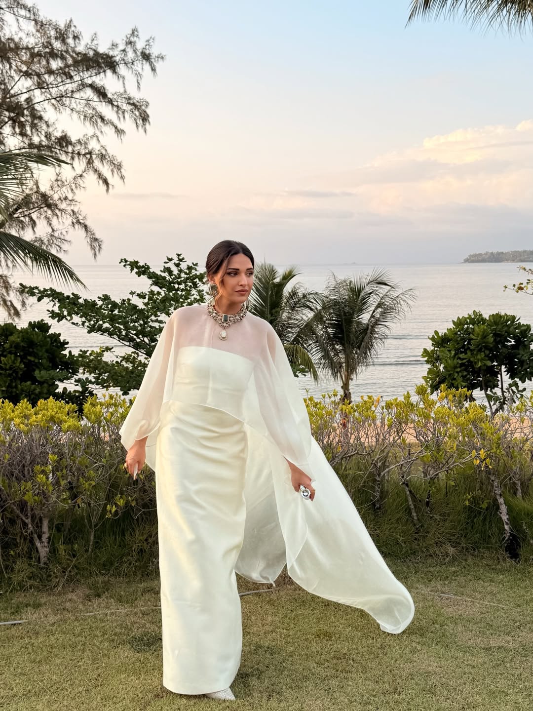 Himanshi Khurana rocks a floaty ivory ensemble with a crisp column base and a breezy sheer layer that moves like air.