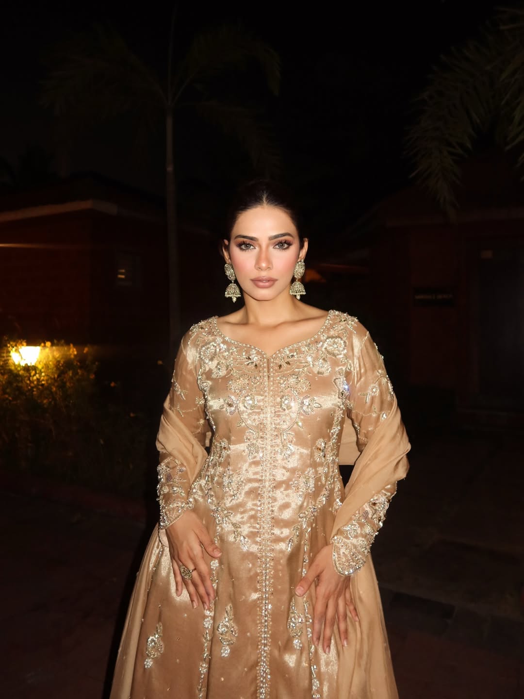 Nagma Mirajkar keeps the makeup subtle and warm, blending effortlessly with the gown&rsquo;s golden tones.