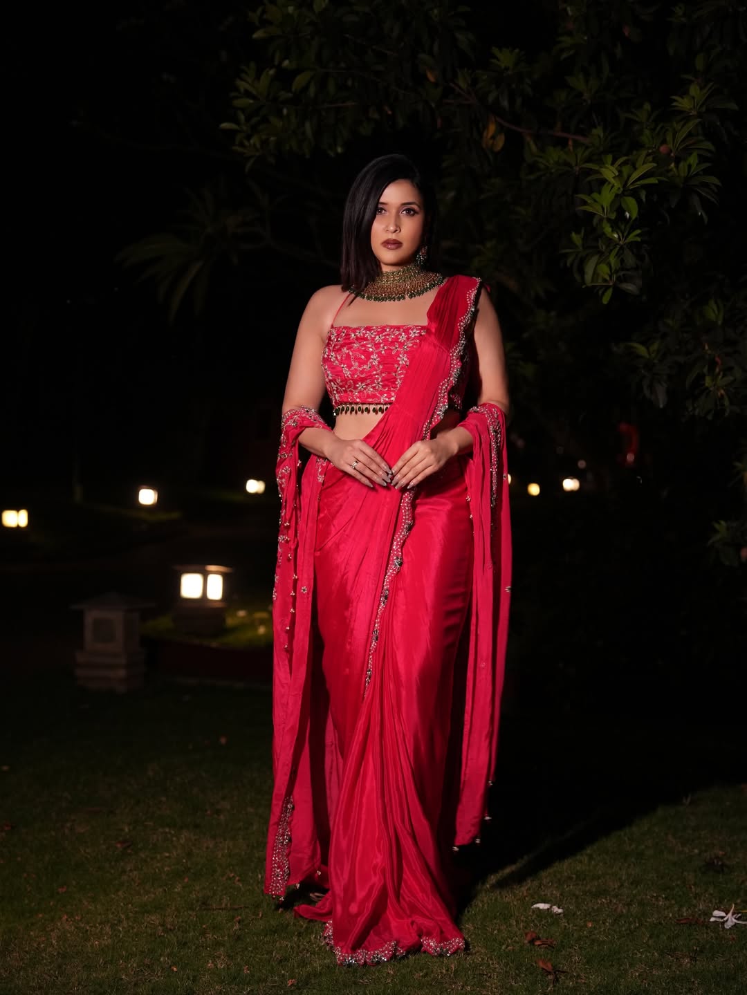 Mannara Chopra keeps the makeup clean and glowing, highlighting the outfit&rsquo;s dramatic color.