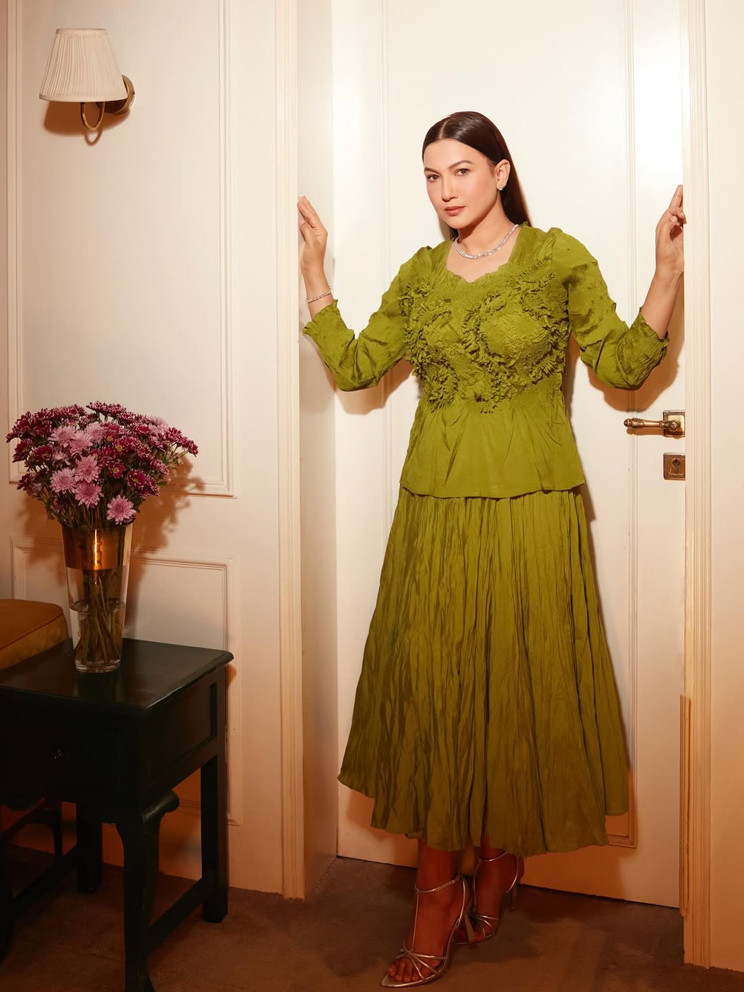 Gauahar Khan owns the scene in an earthy two‑piece set, blending soft pleats with chic layering for effortless charm.