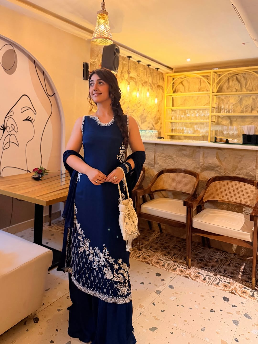 Ashnoor Kaur rocks a deep blue outfit with smooth fabric and a clean, elegant silhouette.