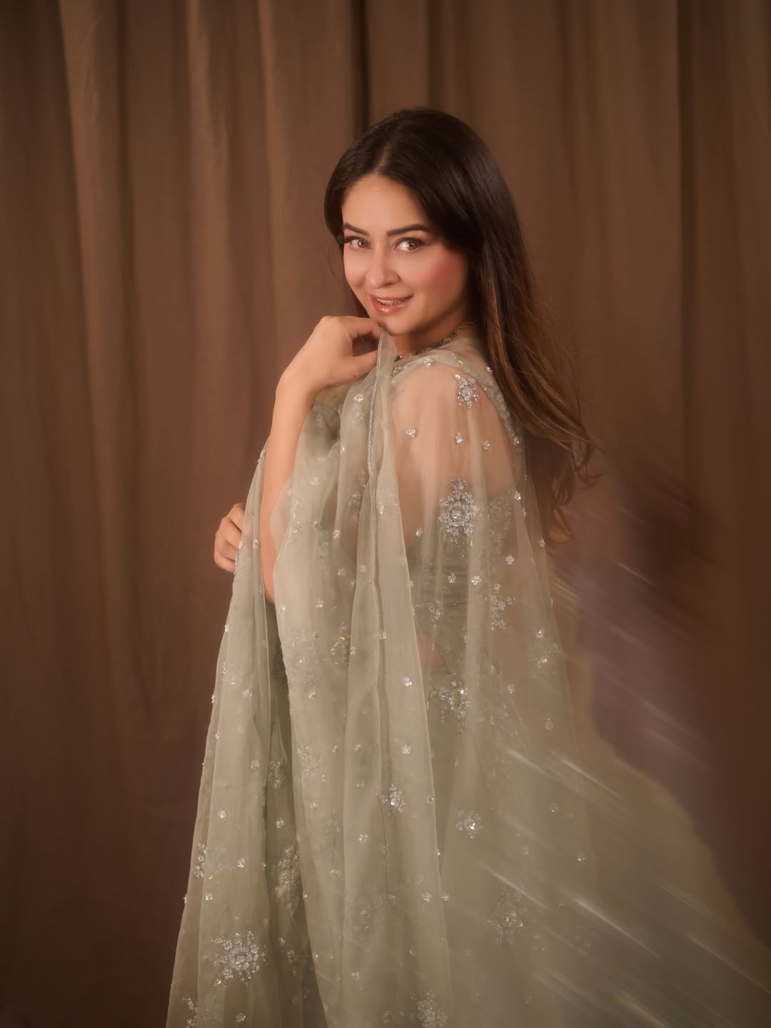 Mahhi Vij pairs the ensemble with natural glam and easy, effortless hair that keeps the overall look calm and cohesive.