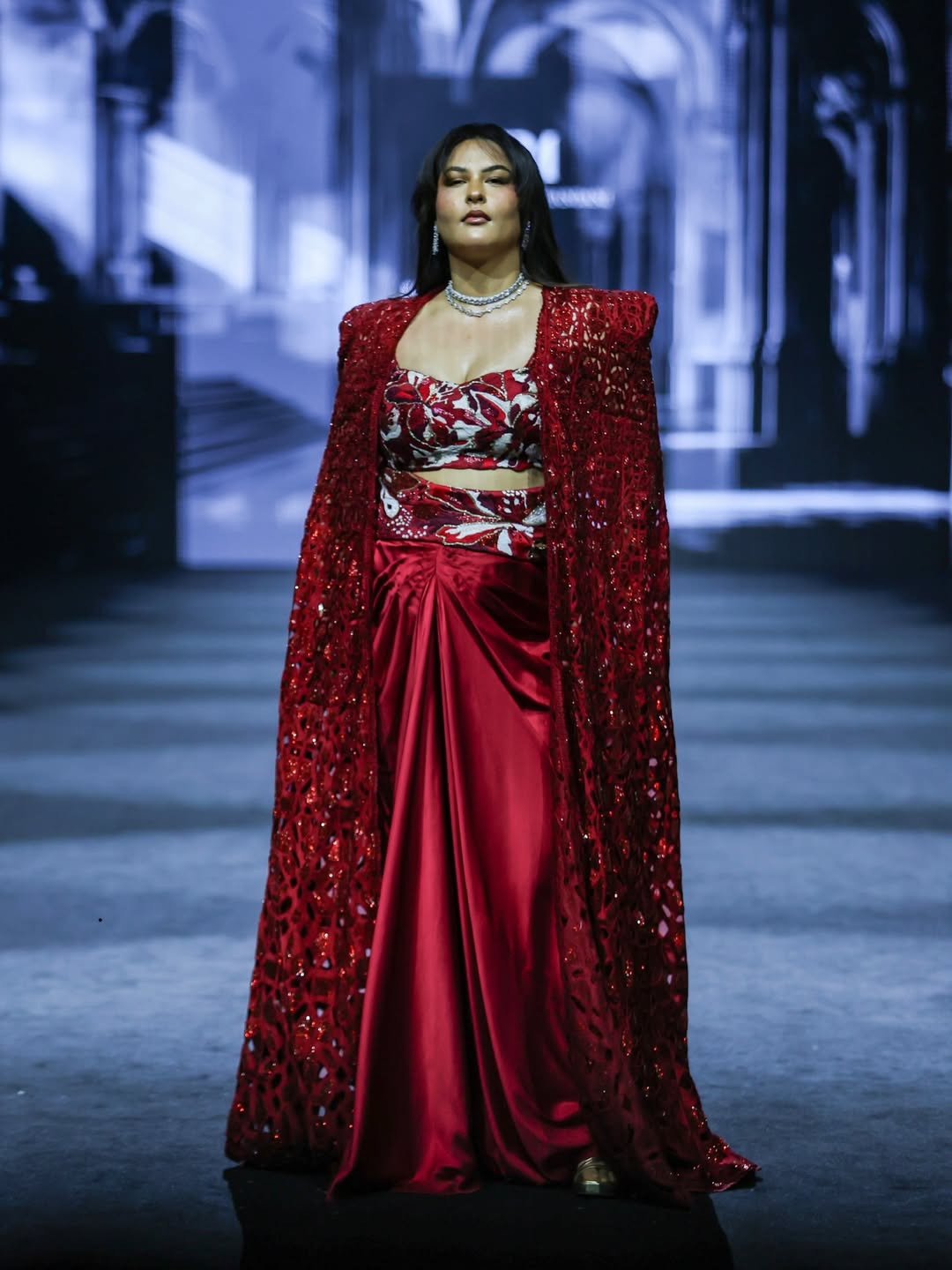 Sakshi Sindwani stuns in a deep red draped skirt paired with a bold embroidered top, serving full runway drama.