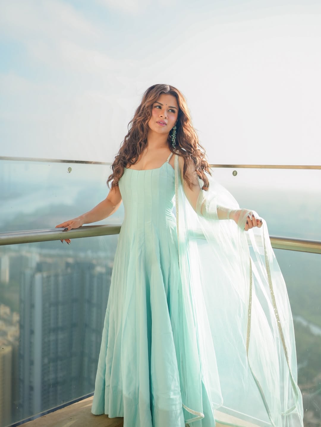 Avneet Kaur styles the look with statement earrings and a sheer dupatta, keeping the accessorising subtle yet striking.