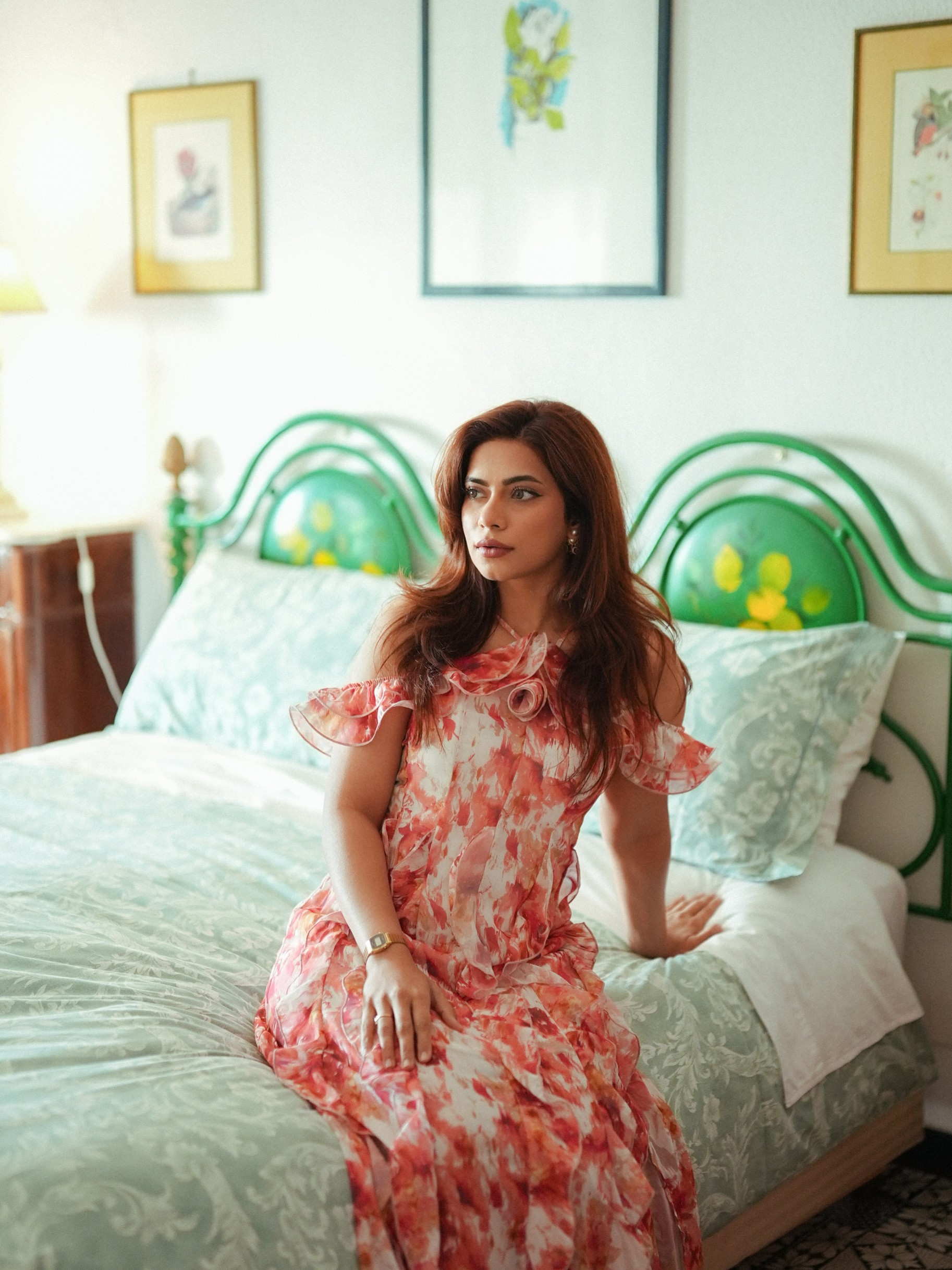 The off-shoulder neckline and ruffled accents add a graceful touch to Nagma Mirajkar's breezy ensemble.