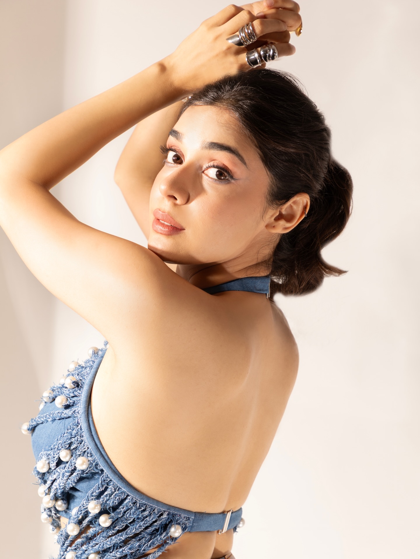 Eisha Singh stands out in a unique blue co-ord featuring distressed textures and intricate pearl embellishments.