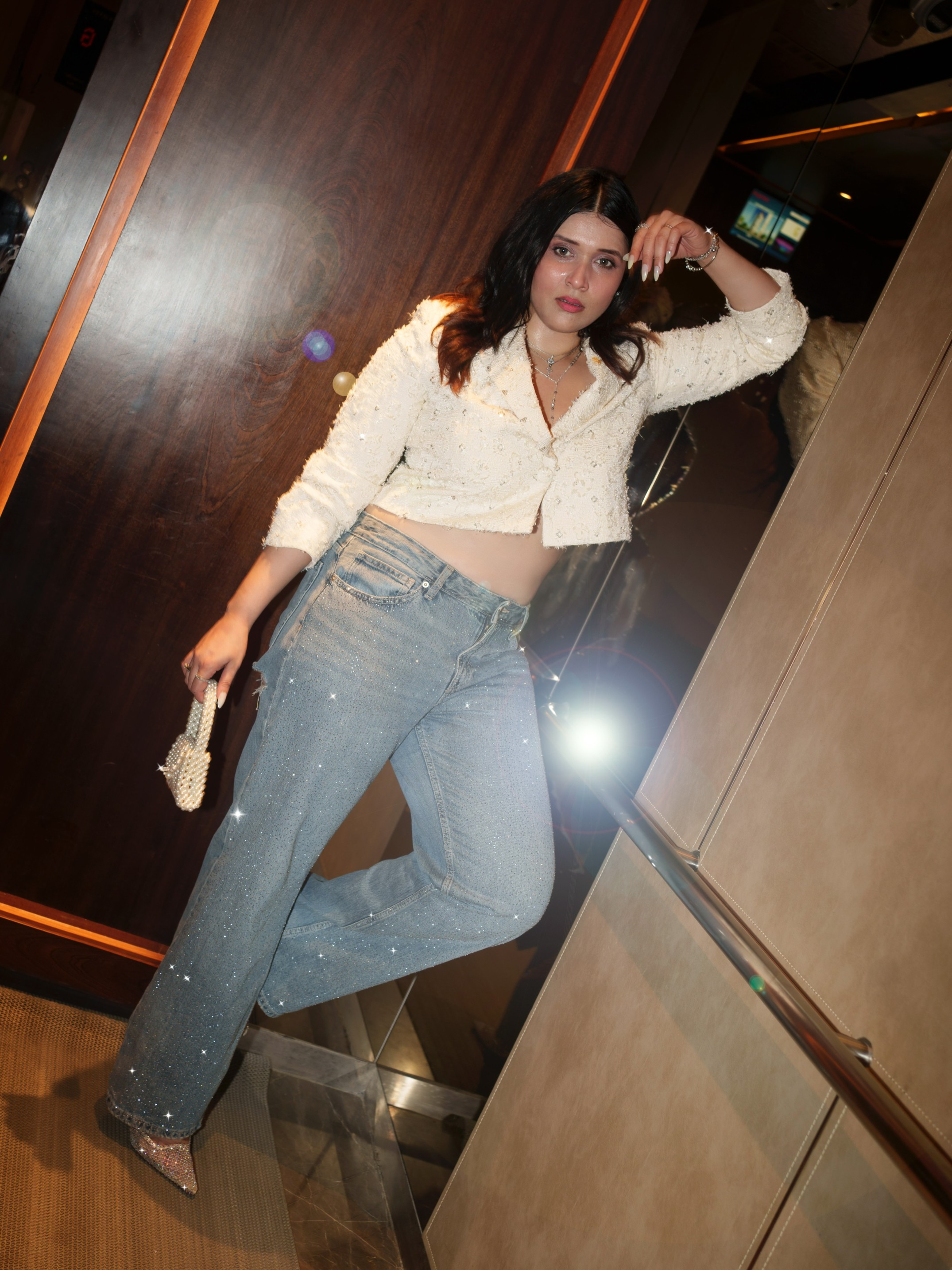 Mannara Chopra elevates classic blue denims with subtle sparkle, turning an everyday staple into a party-ready statement.
