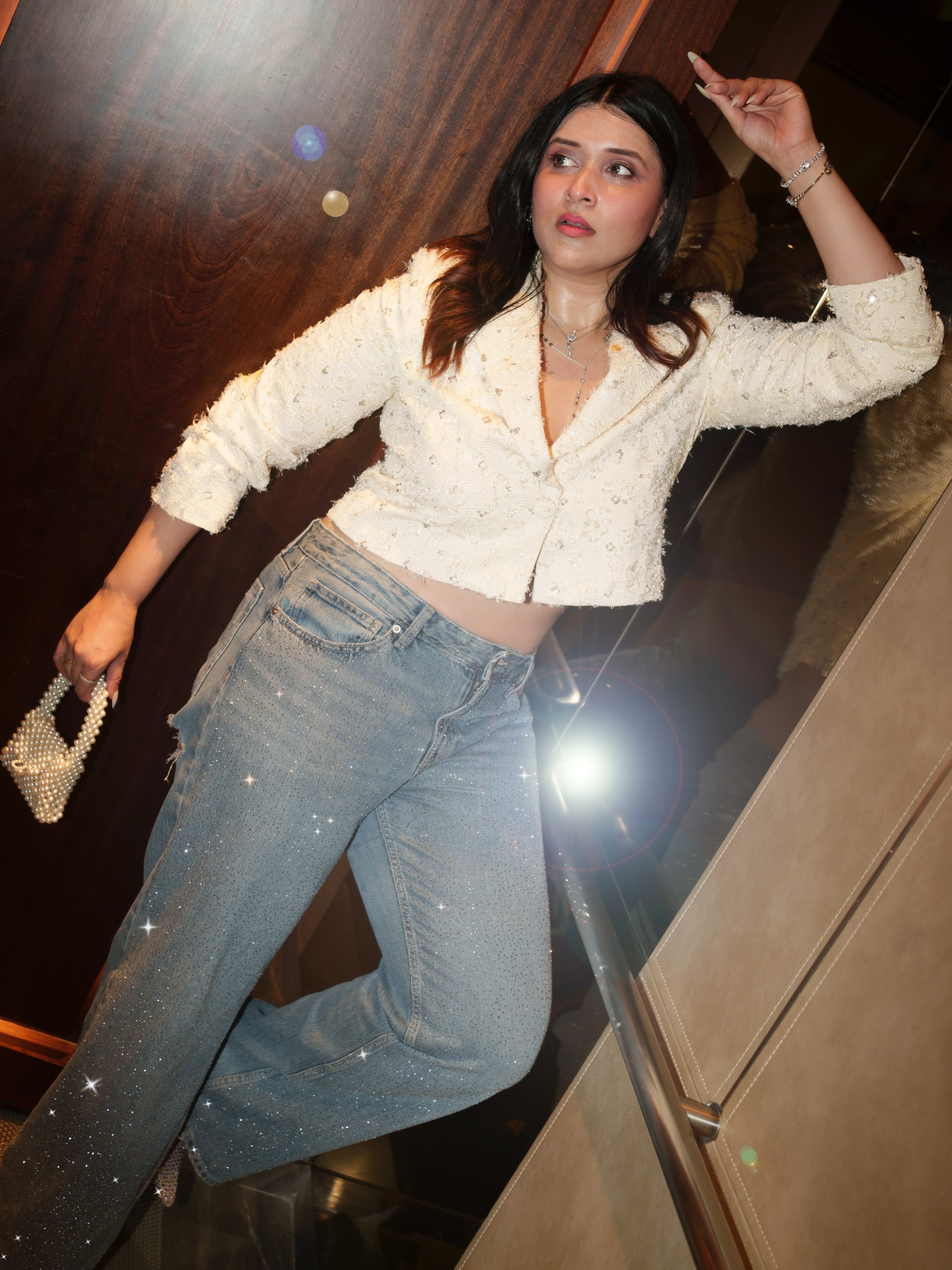 Mannara Chopra's embellished bottoms catch the light beautifully, bringing just the right amount of drama to the outfit.