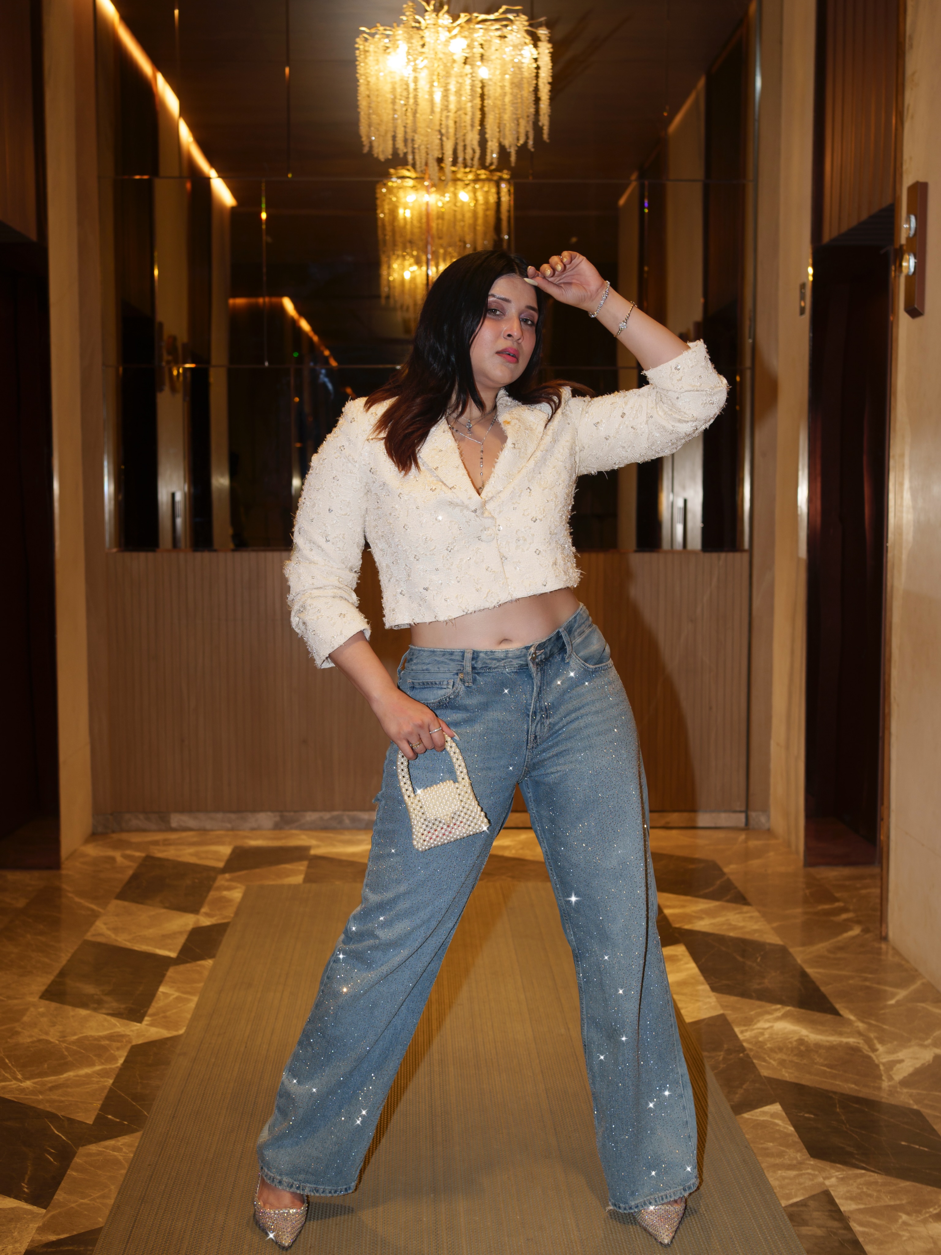 Mannara Chopra completes the look with sleek hair, soft glam makeup, and a confident pose that makes the outfit stand out.