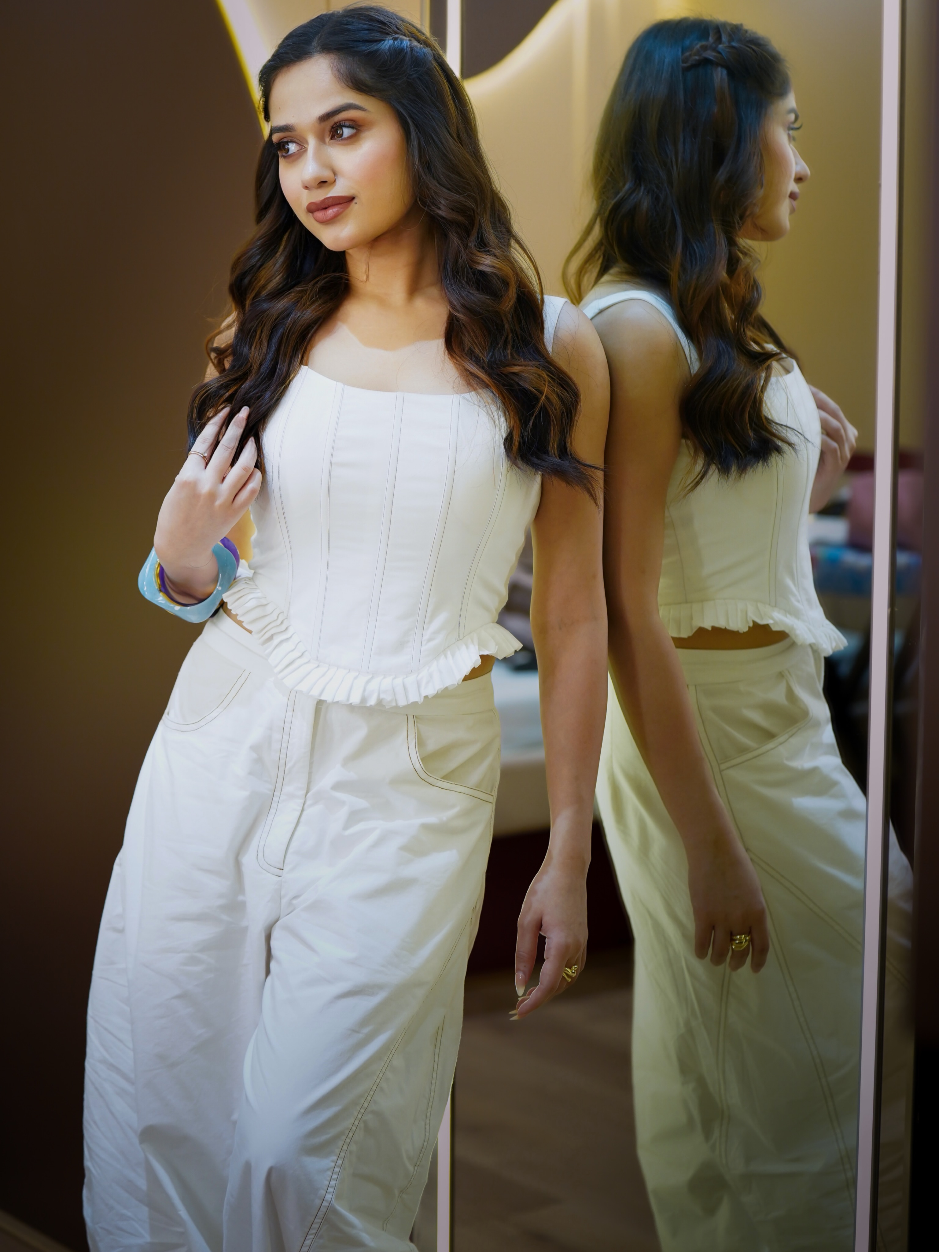 Jannat Zubair makes a striking statement in a structured white corset-style top that brings a polished and contemporary touch to the look.